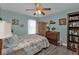 Cozy bedroom with a queen-size bed, ceiling fan, and ample closet space at 1188 Paraclete Rd, Punta Gorda, FL 33983