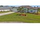 Teal house with two-car garage and well-maintained landscaping at 1188 Paraclete Rd, Punta Gorda, FL 33983