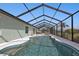 Irregular shaped pool with screen enclosure at 1188 Paraclete Rd, Punta Gorda, FL 33983