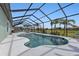 Irregular shaped pool with screen enclosure at 1188 Paraclete Rd, Punta Gorda, FL 33983