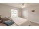 Cozy bedroom featuring a full-size bed and built-in closet at 13039 Ridgely Cir, Port Charlotte, FL 33981