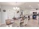 Bright dining room with a wood table and white chairs at 13039 Ridgely Cir, Port Charlotte, FL 33981