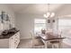 Coastal-themed dining room with a wooden table and white buffet at 13039 Ridgely Cir, Port Charlotte, FL 33981