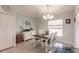 Bright dining area with a wooden table and white chairs at 13039 Ridgely Cir, Port Charlotte, FL 33981