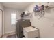 Functional laundry room with washer, dryer, and utility sink at 13039 Ridgely Cir, Port Charlotte, FL 33981