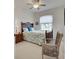 Charming bedroom with a double bed, chair, and natural light at 1347 Hedgewood Cir, North Port, FL 34288