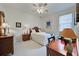 Cozy bedroom with double bed, desk, and ample natural light at 1347 Hedgewood Cir, North Port, FL 34288