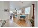 Bright dining room with table, chairs, and hardwood floors at 1347 Hedgewood Cir, North Port, FL 34288