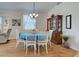 White table and chairs set in the dining room at 1347 Hedgewood Cir, North Port, FL 34288