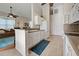 White kitchen with stainless steel appliances and tile floor at 1347 Hedgewood Cir, North Port, FL 34288