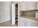 Well-organized pantry with ample shelving for food storage at 1347 Hedgewood Cir, North Port, FL 34288