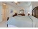 Main bedroom with plush seating and access to bathroom and patio at 1347 Hedgewood Cir, North Port, FL 34288