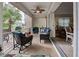 Relaxing screened sunroom with wicker furniture at 1347 Hedgewood Cir, North Port, FL 34288