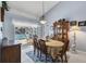 Dining room with table, chairs, and access to a screened-in pool area at 14057 Maxwell Ave, Port Charlotte, FL 33953