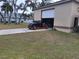 Detached garage with a classic car at 14057 Maxwell Ave, Port Charlotte, FL 33953