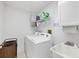 Laundry room with washer, dryer, and utility sink at 14057 Maxwell Ave, Port Charlotte, FL 33953