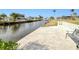 Private canal access with concrete dock and bench at 148 Salem Nw Ave, Port Charlotte, FL 33952