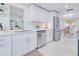 Modern kitchen with white shaker cabinets, quartz counters, and stainless steel appliances at 148 Salem Nw Ave, Port Charlotte, FL 33952