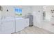 Laundry room with washer, dryer, and extra storage at 148 Salem Nw Ave, Port Charlotte, FL 33952