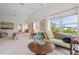 Bright main bedroom featuring sitting area and large windows at 1511 Casey Key Dr, Punta Gorda, FL 33950