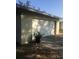 Attached garage with white door and landscaping at 15570 Rasmussen Rd, Punta Gorda, FL 33982