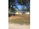 Single story home with metal roof, and a fenced yard at 15570 Rasmussen Rd, Punta Gorda, FL 33982