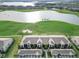 Aerial of townhouses near golf course and lake at 15960 Grassland Ln # 2722, Punta Gorda, FL 33982