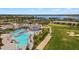 Resort-style pool with lounge chairs at 15960 Grassland Ln # 2722, Punta Gorda, FL 33982