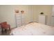 Bedroom with floral bedding and a pink chair at 1601 Park Beach Cir # 136/18, Punta Gorda, FL 33950