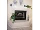 Modern fireplace with white marble surround and decorative accents at 1601 Park Beach Cir # 136/18, Punta Gorda, FL 33950