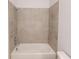 Large bathtub with tiled surround at 17565 Opal Sand Dr # 401, Venice, FL 34293