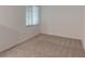 Spacious bedroom with neutral wall colors, carpet, and a window at 17565 Opal Sand Dr # 401, Venice, FL 34293