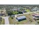 Aerial view of single-story home with fenced backyard, located in a residential neighborhood at 18086 Clanton Ave, Port Charlotte, FL 33948