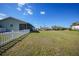 Large backyard with grassy area, providing ample space at 18086 Clanton Ave, Port Charlotte, FL 33948