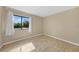 Simple bedroom with tile floors and window with curtains at 18086 Clanton Ave, Port Charlotte, FL 33948