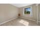 Bright bedroom featuring tile flooring and a window with natural light at 18086 Clanton Ave, Port Charlotte, FL 33948