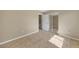 Bright bedroom with tile floors and mirrored closet doors at 18086 Clanton Ave, Port Charlotte, FL 33948