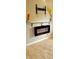 Modern electric fireplace with granite mantel and neutral wall colors at 18086 Clanton Ave, Port Charlotte, FL 33948