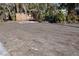 Large backyard with cleared lot and wooden fence at 201 Winson Ave, Englewood, FL 34223