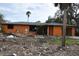 Orange single story house undergoing renovation, lot is cleared at 201 Winson Ave, Englewood, FL 34223