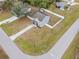 Aerial view of a two-story house with a fenced yard and driveway at 22116 Seaton Ave, Port Charlotte, FL 33954