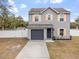 Two-story house with gray siding and orange shutters at 22116 Seaton Ave, Port Charlotte, FL 33954