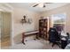 Bright home office featuring a desk, keyboard, and bookshelves at 22116 Seaton Ave, Port Charlotte, FL 33954