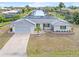 Single story home with attached garage and canal view at 2341 W Marion Ave, Punta Gorda, FL 33950