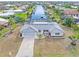 Single story home with attached garage, pool, and canal view at 2341 W Marion Ave, Punta Gorda, FL 33950