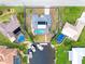 Property view showcasing pool, dock, and canal access at 2341 W Marion Ave, Punta Gorda, FL 33950