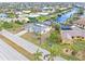 Aerial view of canal front home with pool and boat at 2341 W Marion Ave, Punta Gorda, FL 33950