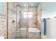 Spa-like bathroom with a walk-in shower and stone tile at 2341 W Marion Ave, Punta Gorda, FL 33950