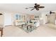 Open concept living space with white sofas and a view of the kitchen at 2341 W Marion Ave, Punta Gorda, FL 33950