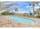 Inviting pool with screened enclosure and canal view at 2341 W Marion Ave, Punta Gorda, FL 33950